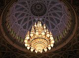 Muscat 04 Grand Mosque 05 Chandelier Hanging From Central Dome The main prayer hall has a large ornate chandelier made of Swarovski crystal and gilded metals hanging from the central dome, which  rises to a height of 50m above the floor.